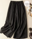 FJØRNA women's lightweight summer trousers with wide leg, breathable, flowy fabric, perfect for warm weather and casual wear.