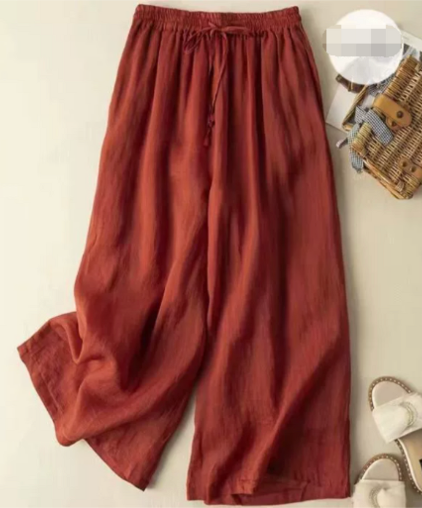 FJØRNA lightweight summer women's wide-leg trousers, breathable and flowy fabric, perfect for warm weather and casual wear.