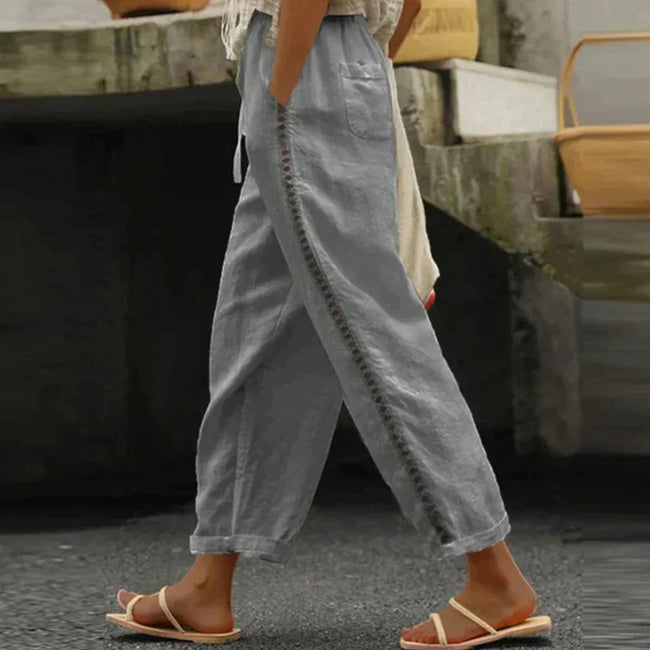 FJØRNA women's linen summer trousers, tapered high waist, light and breathable fabric, shown in a natural relaxed fit style