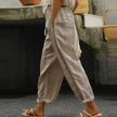FJØRNA linen summer trousers for women, high waist tapered fit, light and breathable fabric, shown in a relaxed fit.