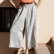 FJØRNA linen wide-leg women's trousers with drawstring pull-on design, lightweight and comfortable for casual wear.