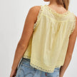 FJØRNA lace cami top for women with front tie, featuring delicate lace fabric and stylish sleeveless design.