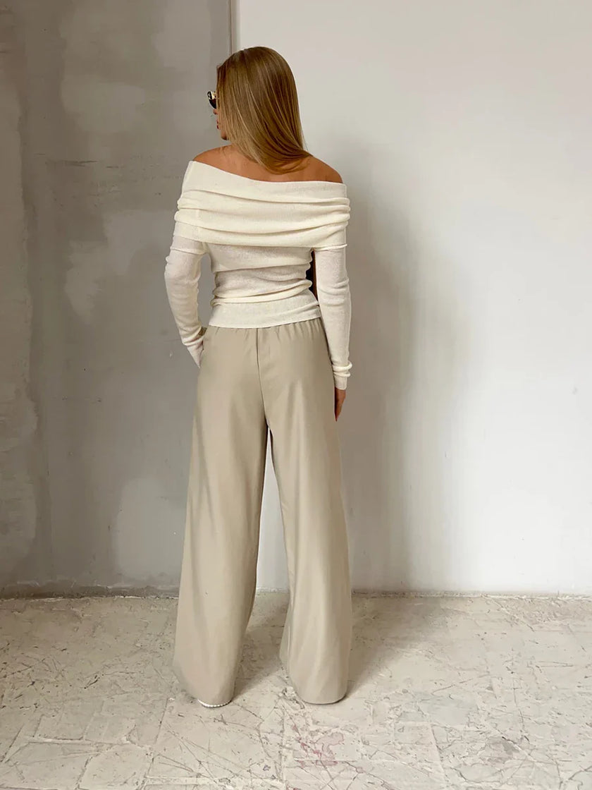 FJØRNA women's ribbed knit off-shoulder top with a mock neck, showcasing a fitted and textured design perfect for casual wear.
