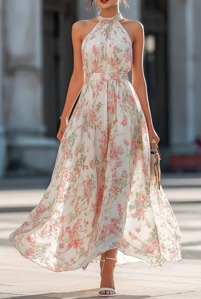 FJØRNA Fiona Flowy White Halter Maxi Dress with open back and airy fabric, perfect for summer or special occasions.