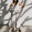 FJØRNA women's linen cropped culotte trousers with wide-leg design, lightweight and breathable for casual or stylish wear.
