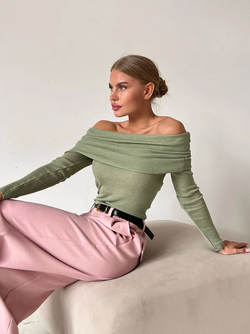 FJØRNA ribbed knit off-shoulder women's top with mock neck, featuring a fitted design and stylish neckline, on a white background.