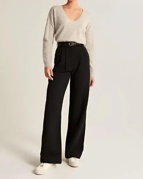 White wide-leg high-waist trousers for women by FJØRNA, featuring a relaxed fit and elegant high-waist design.