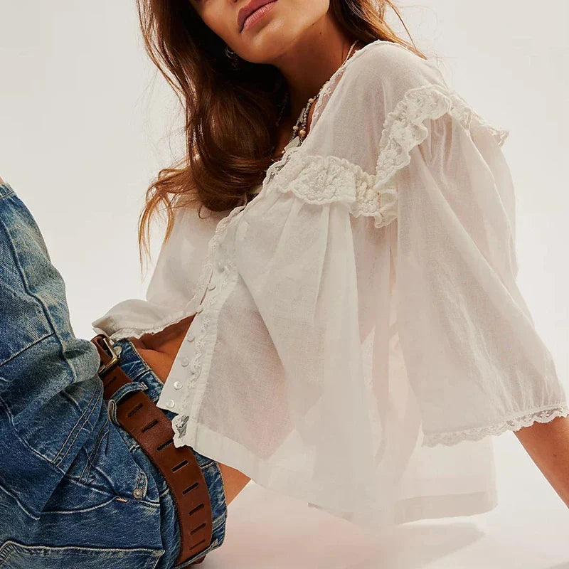 FJØRNA white cropped cotton blouse for women with lace trim, stylish top featuring a feminine design and lightweight fabric.