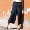 FJØRNA women's linen wide-leg trousers with drawstring waist, pull-on style, relaxed fit, and lightweight fabric.