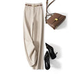 Women’s wide-leg wool trousers by FJØRNA, high-waist pants with a tailored fit and soft fabric, shown on a model.