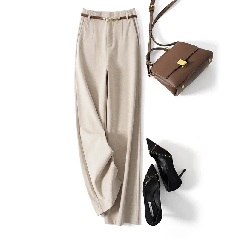 Women’s wide-leg wool trousers by FJØRNA, high-waist pants with a tailored fit and soft fabric, shown on a model.