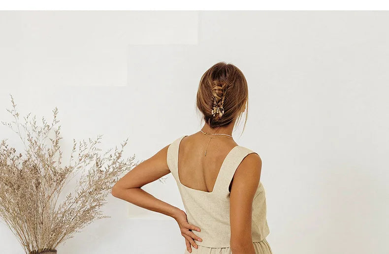 FJØRNA linen wide-leg trousers for women featuring loose pull-on design and relaxed fit, shown in natural fabric and style.