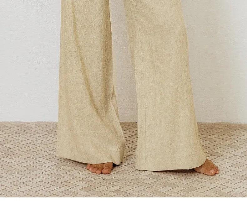 FJØRNA linen wide-leg trousers for women, loose pull-on pants with relaxed fit and natural linen fabric, shown in a neutral color.
