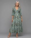 FJØRNA women's floral halter neck sleeveless maxi dress, elegant and flowing with vibrant bloom pattern and halter design.