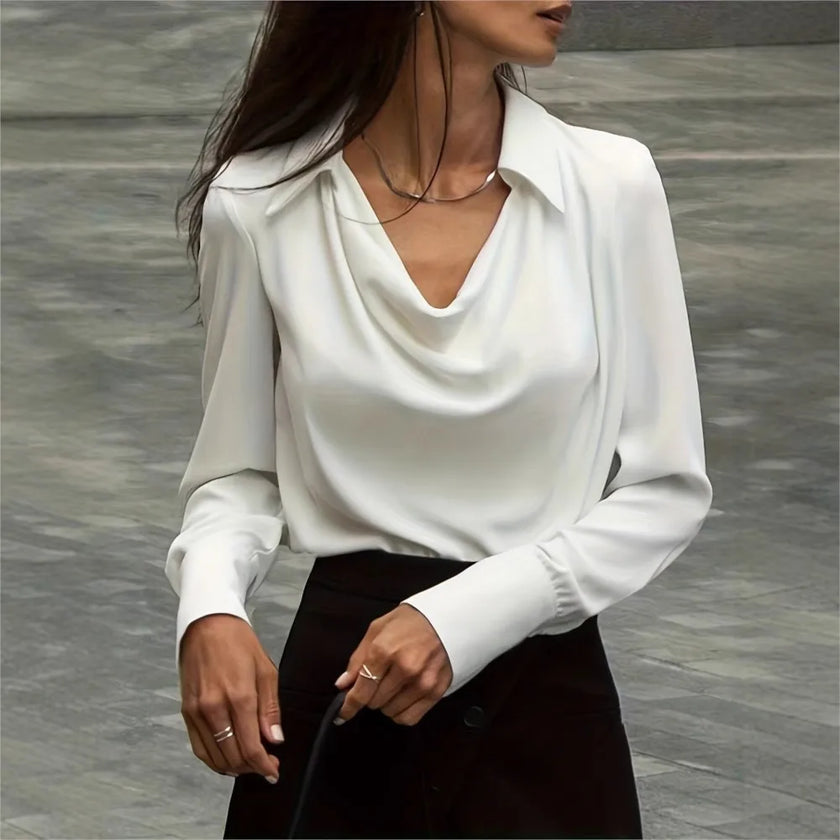FJØRNA satin cowl-neck long-sleeve women's blouse in white, stylish top with elegant drape and soft fabric.