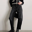 FJØRNA women's denim jeans with a barrel leg fit, showcasing classic blue denim with a relaxed, stylish silhouette.