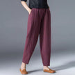 FJØRNA lightweight summer tapered women's trousers with elastic waist, relaxed fit, ideal for warm weather wear.