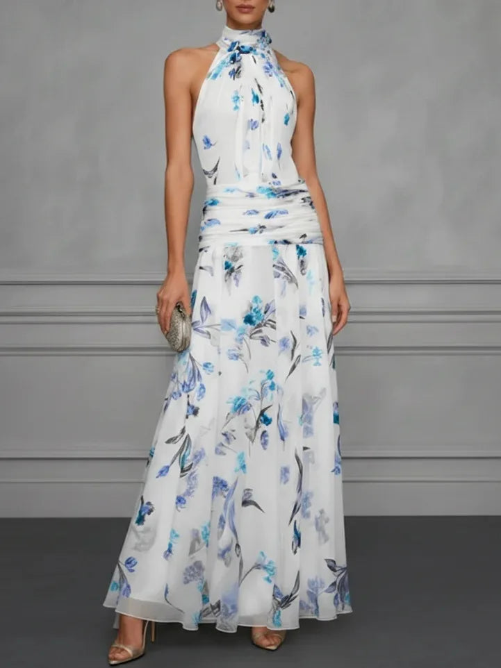 Jasmine floral halter wedding guest dress by FJØRNA, lightweight fabric with elegant floral print and halter neckline.
