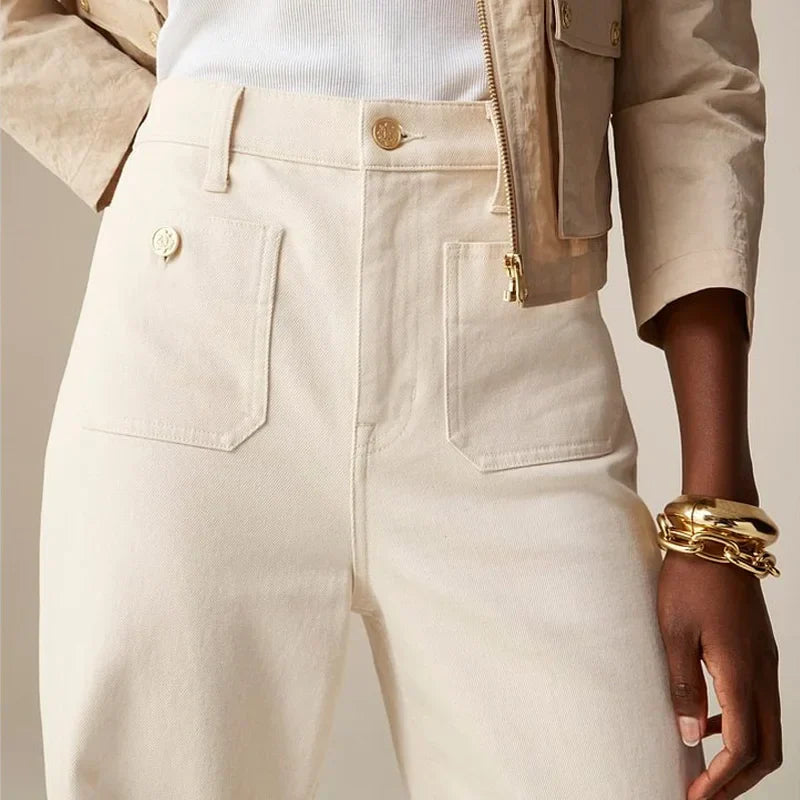 Women’s wide-leg cotton jeans by FJØRNA, high-waist pants with a relaxed fit, shown on a model.