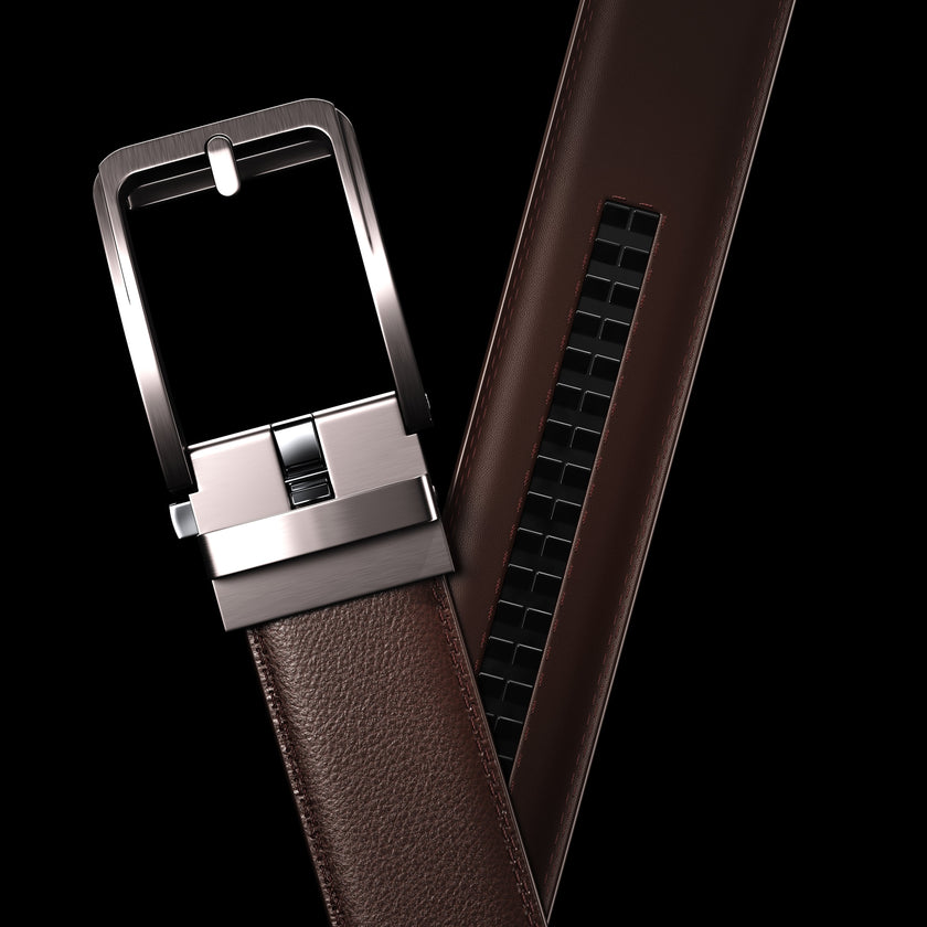 Brown vegan leather ratchet belt by FJØRNA, adjustable unisex belt with sleek design and secure buckle.