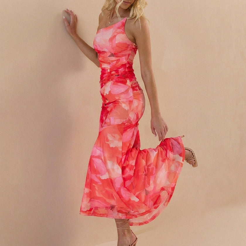 Side view of FJØRNA elegant one-shoulder maxi dress for women, featuring a fitted bodycon silhouette and stylish design.