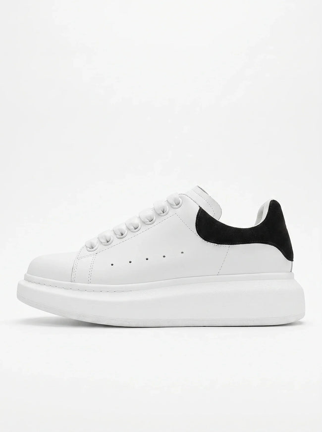 FJØRNA men's white lace-up trainers with minimalist design, side profile view showcasing casual and versatile everyday shoes.