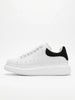 FJØRNA men's white lace-up trainers with minimalist design, side profile view showcasing casual and versatile everyday shoes.