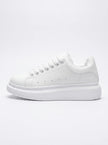 FJØRNA men's white lace-up trainers with minimalist design, side profile view showcasing sleek, casual everyday shoes for men.