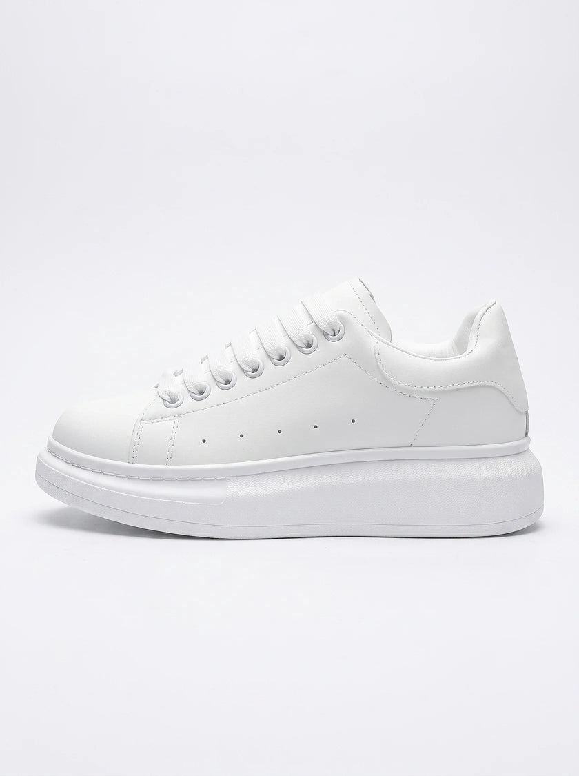 FJØRNA men's white lace-up trainers with minimalist design, side profile view showcasing sleek, casual everyday shoes for men.