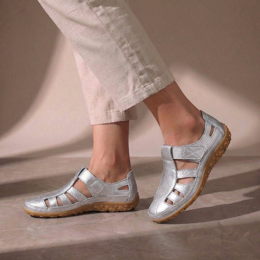 Silver FJØRNA orthopedic closed-toe sandals with cutout details and a comfortable fit, showcasing stylish and supportive footwear.