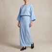 Sky blue FJØRNA women's summer two-piece wrap co-ord set featuring a matching top and skirt.