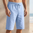 Sky blue men's FJØRNA linen drawstring chino shorts with a tailored fit and relaxed waistband, suitable for casual summer wear.