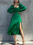 FJØRNA slit women's midi dress featuring a sleek design, perfect for day to night wear, displayed on a mannequin.