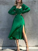 FJØRNA slit women's midi dress featuring a sleek design, perfect for day to night wear, displayed on a mannequin.