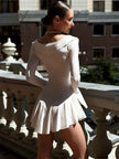Soft girl ruffled mini dress by FJØRNA, featuring a feminine design with ruffles, perfect for party and daytime wear.