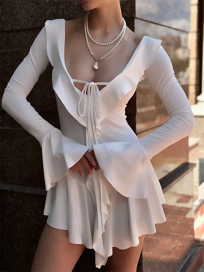 Soft Girl ruffled mini dress by FJØRNA featuring a feminine design, perfect for party and day wear, with delicate ruffle details.