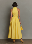 FJØRNA striped maxi dress for women featuring a flowing design, vibrant horizontal stripes, and a sleeveless style.