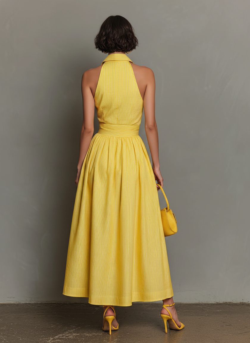 FJØRNA striped maxi dress for women featuring a flowing design, vibrant horizontal stripes, and a sleeveless style.