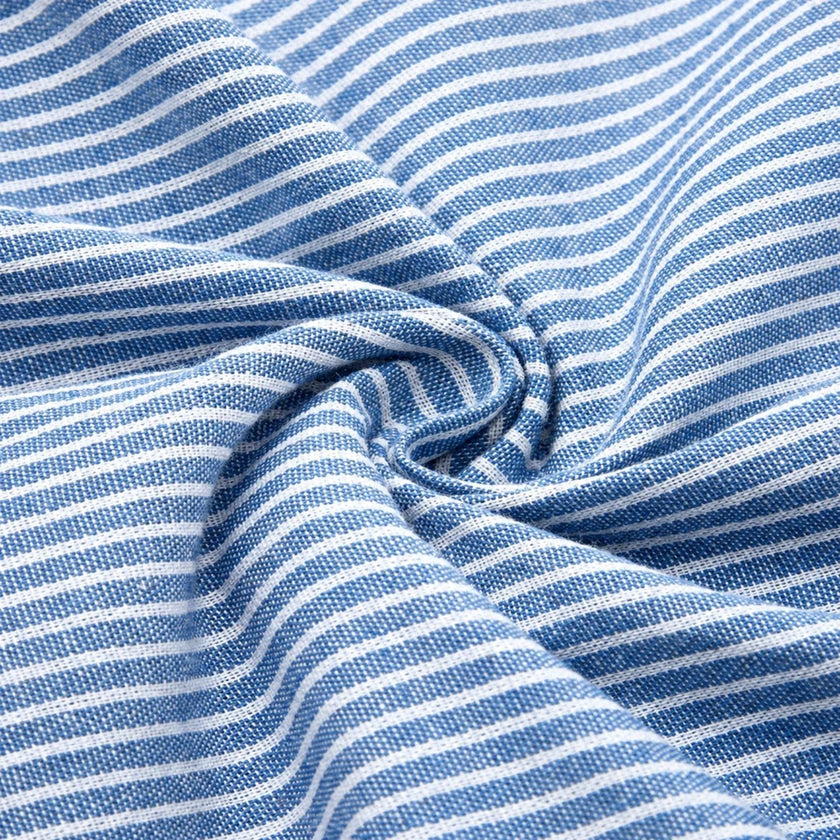 FJØRNA women's striped midi dress with button details and side pockets, stylish and comfortable for everyday wear.