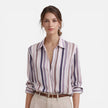 Lightweight women's summer blouse with vertical stripes from FJØRNA, featuring a relaxed fit and stylish design.
