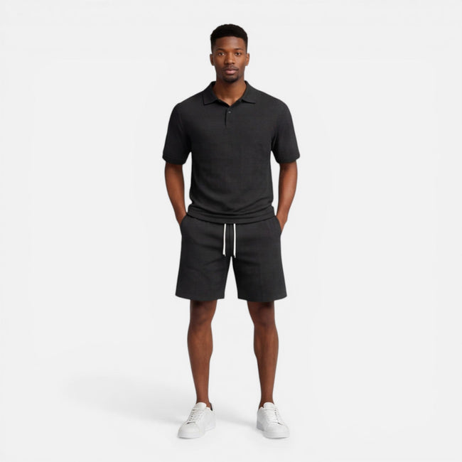 Men's breathable knit polo shorts set by FJØRNA, featuring a structured design for summer fashion, includes a polo shirt and shorts.