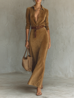 FJØRNA women's suede maxi dress, flowing design with long sleeves and V-neck, shown on a hanger.