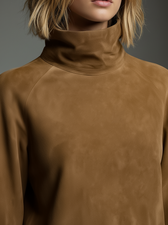 FJØRNA women's suede turtleneck mini dress, showcasing a fitted silhouette with long sleeves and a high neckline.