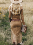 FJØRNA tassel midi casual dress with flowing fabric and tassel details, displayed on a hanger.