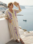Floral summer maxi dress for women by FJØRNA with V-neck and short sleeves, perfect for warm weather and casual outings.