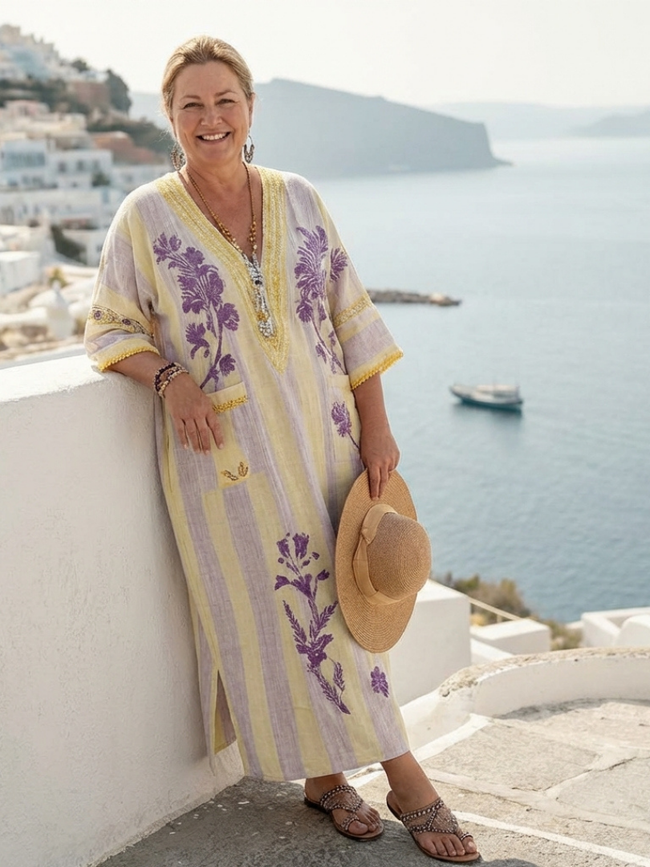 FJØRNA women's floral summer maxi dress with pockets, flowing fabric, and a vibrant print, perfect for warm weather.
