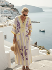 FJØRNA summer maxi dress for women with a floral pattern and pockets, flowing sleeveless design perfect for warm weather.