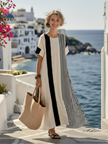 FJØRNA summer maxi dress for women with striped pattern, short sleeves, and flowy design, perfect for warm weather.