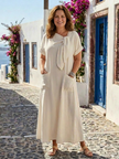 FJØRNA summer maxi dress for women with short sleeves and pockets, flowing fabric in a bright, stylish design.