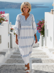 FJØRNA women's summer maxi dress with V-neck and long sleeves, flowing lightweight fabric, elegant and comfortable for warm weather.